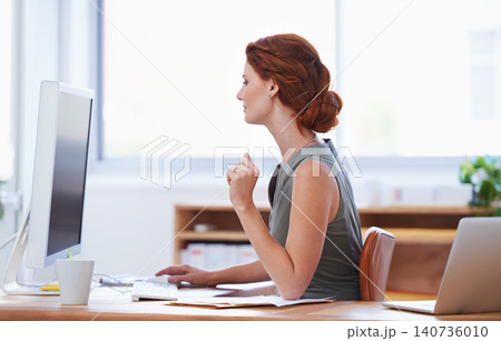 Business woman, computer and reading at office desk for online planning, copywriting and social media. Professional employee, worker or writer on desktop for website, newsletter and typing a report Business woman, computer and reading at office desk for online planning, copywriting and social media. Professional employee, worker or writer on desktop for website, newsletter and typing a report 140736010