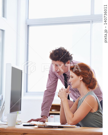 Business people, teamwork and support on computer for training, advice or feedback on copywriting or project. Professional editor, leader or man and woman reading on desktop of report or editing Business people, teamwork and support on computer for training, advice or feedback on copywriting or project. Professional editor, leader or man and woman reading on desktop of report or editing 140736011