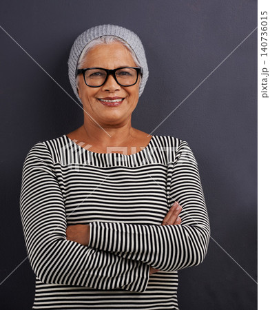 Portrait, old woman and fashion with glasses, arms crossed and happiness on dark studio background. Face, old person and model with confidence and eyewear with clear vision, hipster or stylish outfit 140736015