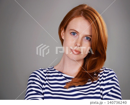 Serious, gray background and portrait of business woman with red hair for career, work and job. Professional, ginger and isolated person with confidence, company pride and positive attitude in studio Serious, gray background and portrait of business woman with red hair for career, work and job. Professional, ginger and isolated person with confidence, company pride and positive attitude in studio 140736240