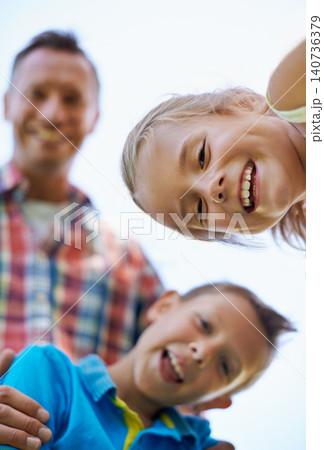 Portrait, low angle and family with summer happiness and bonding together with weekend break. Face, parents and mother with father and children with fun and sunshine with kids and joyful with smile Portrait, low angle and family with summer happiness and bonding together with weekend break. Face, parents and mother with father and children with fun and sunshine with kids and joyful with smile 140736379