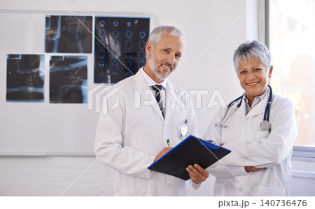 Doctors, checklist and portrait in hospital with collaboration for medical advice, support and xray results. Healthcare, radiology and mature people with teamwork for schedule, consultation or review Doctors, checklist and portrait in hospital with collaboration for medical advice, support and xray results. Healthcare, radiology and mature people with teamwork for schedule, consultation or review 140736476