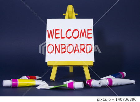 Welcome onboard symbol. Concept words Welcome onboard on wooden blocks. Beautiful deep blue background with paints and easel. Business and Welcome onboard concept. Copy space. Welcome onboard symbol. Concept words Welcome onboard on wooden blocks. Beautiful deep blue background with paints and easel. Business and Welcome onboard concept. Copy space. 140736896