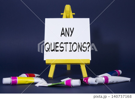 Any Questions symbol. Wooden blocks with words Any Questions . Beautiful deep blue background with paints and easel. Business and Any Questions concept. Copy space. Any Questions symbol. Wooden blocks with words Any Questions . Beautiful deep blue background with paints and easel. Business and Any Questions concept. Copy space. 140737168