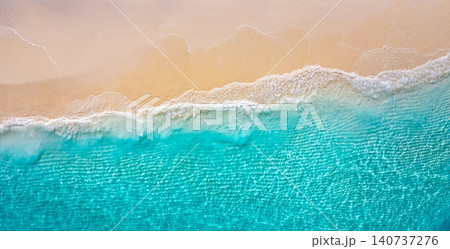Soft waves lapping powdery golden shore. Aerial turquoise water meeting pristine sand. Dreamy drone top view tropical beach, serene summer coastal escape Soft waves lapping powdery golden shore. Aerial turquoise water meeting pristine sand. Dreamy drone top view tropical beach, serene summer coastal escape 140737276