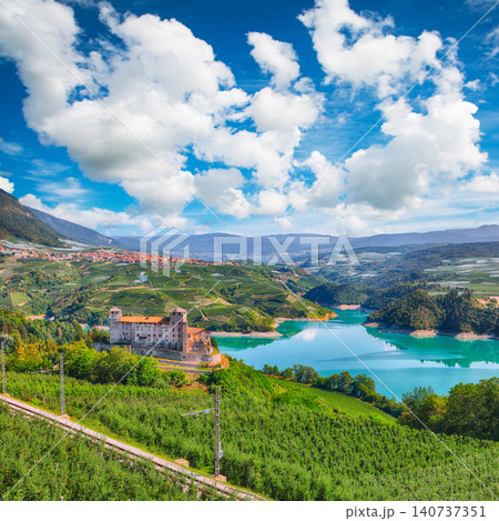 Gorgeous View of the Cles Castel, the Santa Giustina Lake and lots of apple plantations. 140737351