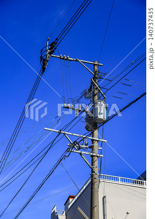 AC high-voltage power transformer, Electrical Transformer and High voltage power lines installed on electric pole. AC high-voltage power transformer, Electrical Transformer and High voltage power lines installed on electric pole. 140737435
