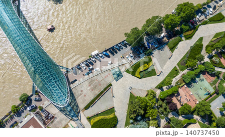 Aerial view on panorama of Kura river amd PEDESTRIAN Bridge in Tbilisi Aerial view on panorama of Kura river amd PEDESTRIAN Bridge in Tbilisi 140737450