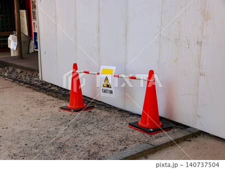 row of orange fluorescent, reflex traffic cones on road. row of orange fluorescent, reflex traffic cones on road. 140737504