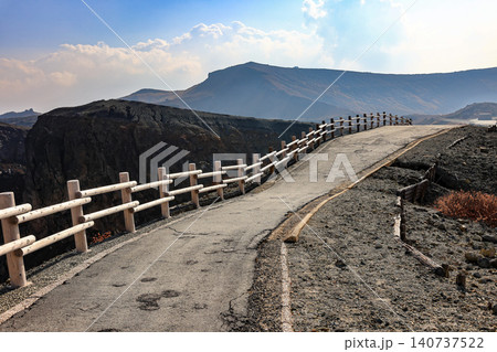 Wooden railing made from Japanese Cypress along the walkway near the volcanic crater. Aso Volcano, Japan. Wooden railing made from Japanese Cypress along the walkway near the volcanic crater. Aso Volcano, Japan. 140737522