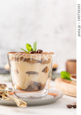 Gourmet Tiramisu Dessert in Glass with Mint Leaf Gourmet Tiramisu Dessert in Glass with Mint Leaf 140738165