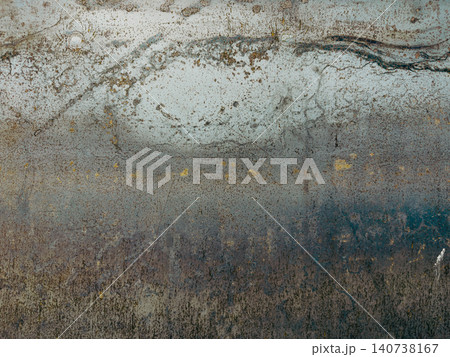 Grungy metal surface featuring abstract patterns of rust and oxidation, creating a raw industrial texture perfect for authentic design backgrounds 140738167