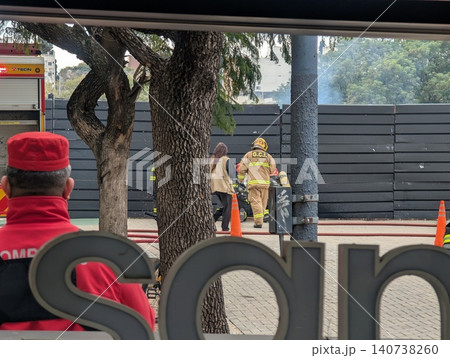 Cordoba, Argentina - June 24, 2026: Firefighters work near safety cones during a training drill Cordoba, Argentina - June 24, 2026: Firefighters work near safety cones during a training drill 140738260