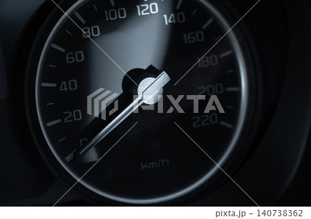 Speedometer shows current speed of a vehicle on a road Speedometer shows current speed of a vehicle on a road 140738362