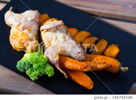 Teriyaki quail with grilled carrots and broccoli Teriyaki quail with grilled carrots and broccoli 140740106