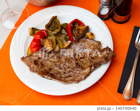 Fried beef with vegetables served on platter Fried beef with vegetables served on platter 140740640