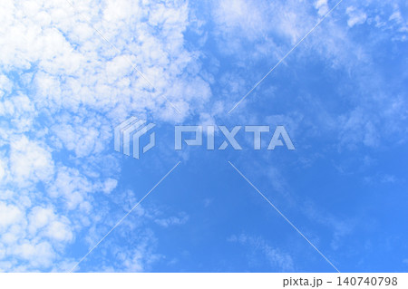 beautiful blue sky and white fluffy group of clouds with sunrise in the morning, natural background beautiful blue sky and white fluffy group of clouds with sunrise in the morning, natural background 140740798
