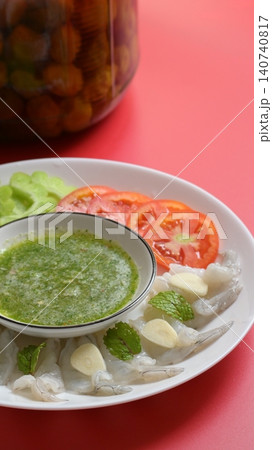 shrimp in fish sauce with Thai spicy seafood dipping sauce on white plate and umeshu 140740817