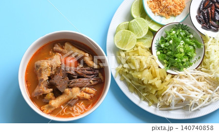 rice vermicelli with northern thai curry sauce on blue background rice vermicelli with northern thai curry sauce on blue background 140740858
