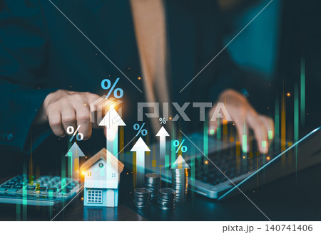 Businessman analyzing real estate market growth graph with rising interest rates percentage icon on laptop computer. Businessman analyzing real estate market growth graph with rising interest rates percentage icon on laptop computer. 140741406