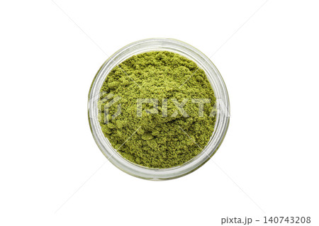 Ground bay leaves fill glass jar with vibrant green color. Flavor infusion concept, PNG Ground bay leaves fill glass jar with vibrant green color. Flavor infusion concept, PNG 140743208