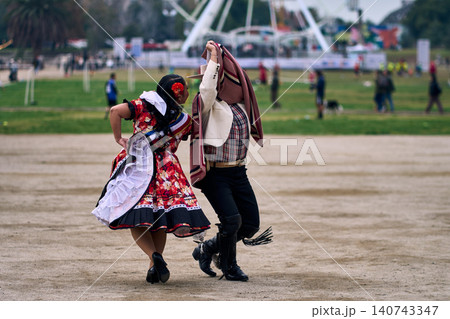 A pair of young Chilean Latin dancers dancing cuecas 140743347