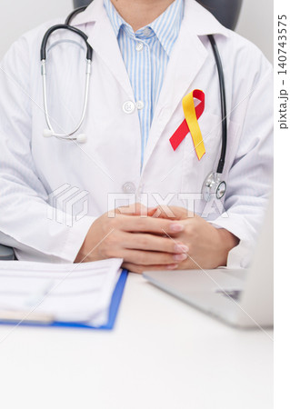 World hepatitis day awareness month, 28 July. doctor using laptop and report notes on notebook. Red and Yellow ribbon for Liver cancer, Jaundice, Cirrhosis, Failure, Enlarged, Hepatic Encephalopathy World hepatitis day awareness month, 28 July. doctor using laptop and report notes on notebook. Red and Yellow ribbon for Liver cancer, Jaundice, Cirrhosis, Failure, Enlarged, Hepatic Encephalopathy 140743575