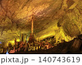 Stalactites and stalagmites colored by light in huge Yellow Dragon Cave near Zhangjiajie, China 140743619