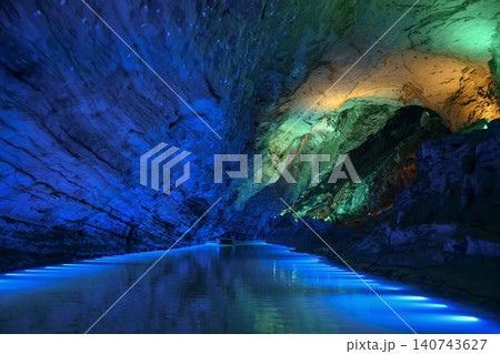 Underwater river illuminated by colored light in Yellow Dragon Cave near Zhangjiajie, China Underwater river illuminated by colored light in Yellow Dragon Cave near Zhangjiajie, China 140743627