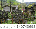 Wooden water wheel system on a stream in Yellow Dragon Park in the mountains near Zhangjiajie, China 140743698