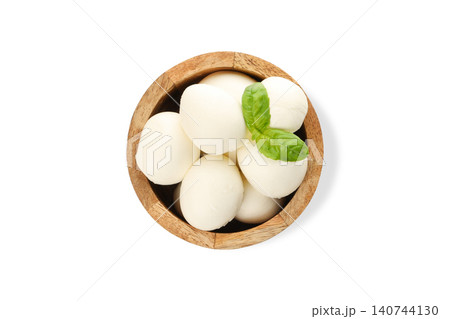 Mozzarella balls with basil in a wooden bowl, PNG 140744130