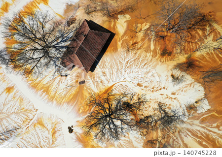 Aerial view choked sinking village house by acid mine drainage toxic waters 140745228