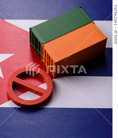 The cargo container ban on the Cuba flag as a conceptual backdrop. The cargo container embargo 140746261
