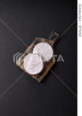 Brie or Camembert cheese is a white, round shape for baking and melting. Camembert cheese Brie or Camembert cheese is a white, round shape for baking and melting. Camembert cheese 140746450