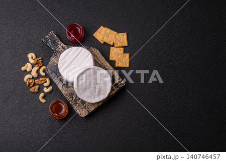 Brie or Camembert cheese is a white, round shape for baking and melting. Camembert cheese Brie or Camembert cheese is a white, round shape for baking and melting. Camembert cheese 140746457