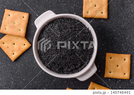 Black caviar from beluga or sturgeon, an expensive delicacy for sandwiches. Black caviar Black caviar from beluga or sturgeon, an expensive delicacy for sandwiches. Black caviar 140746491