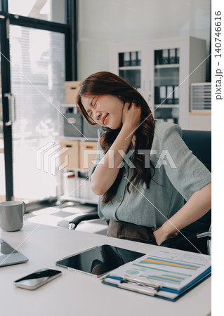 Woman experiencing neck pain due to office work 140746616