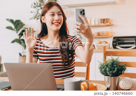 Asian woman using computer remote for business studying, watching online virtual webinar training meeting, video call. asian business woman talking on laptop in home office. Banner, copy space 140746660