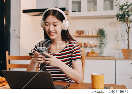 Asian woman using computer remote for business studying, watching online virtual webinar training meeting, video call. asian business woman talking on laptop in home office. Banner, copy space Asian woman using computer remote for business studying, watching online virtual webinar training meeting, video call. asian business woman talking on laptop in home office. Banner, copy space 140746675