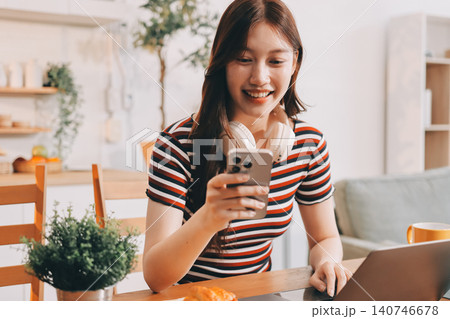 Asian woman using computer remote for business studying, watching online virtual webinar training meeting, video call. asian business woman talking on laptop in home office. Banner, copy space Asian woman using computer remote for business studying, watching online virtual webinar training meeting, video call. asian business woman talking on laptop in home office. Banner, copy space 140746678