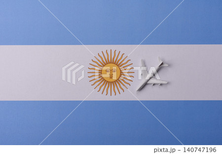 Airplane on the Argentine flag as a conceptual backdrop for flights. Airplane on the Argentine flag Airplane on the Argentine flag as a conceptual backdrop for flights. Airplane on the Argentine flag 140747196