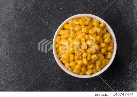 Golden, sweet canned corn kernels or maize for salads and vegetarian dishes. Canned corn Golden, sweet canned corn kernels or maize for salads and vegetarian dishes. Canned corn 140747474