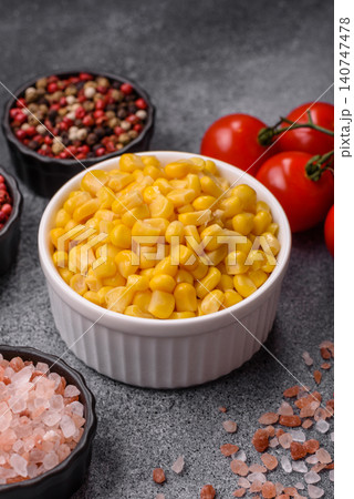 Golden, sweet canned corn kernels or maize for salads and vegetarian dishes. Canned corn 140747478