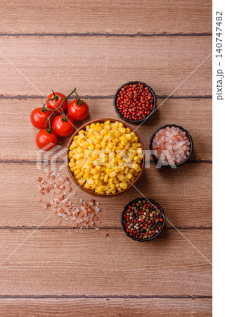 Golden, sweet canned corn kernels or maize for salads and vegetarian dishes. Canned corn 140747482