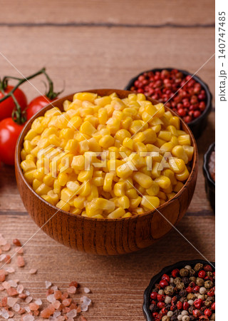 Golden, sweet canned corn kernels or maize for salads and vegetarian dishes. Canned corn Golden, sweet canned corn kernels or maize for salads and vegetarian dishes. Canned corn 140747485
