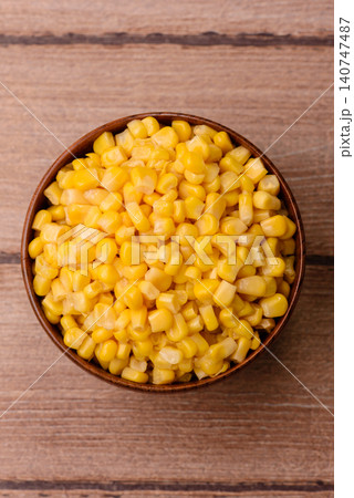 Golden, sweet canned corn kernels or maize for salads and vegetarian dishes. Canned corn 140747487