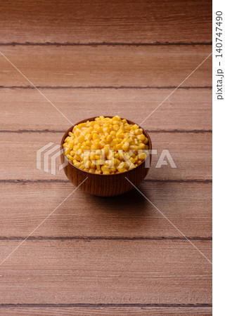 Golden, sweet canned corn kernels or maize for salads and vegetarian dishes. Canned corn 140747490