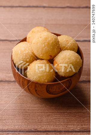 Cheese balls or potato croquettes, golden brown, fried with salt and spices. Cheese balls Cheese balls or potato croquettes, golden brown, fried with salt and spices. Cheese balls 140747699