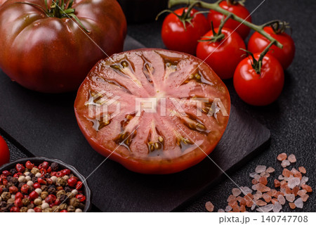 Fresh pink and black tomatoes adora or kumato as an ingredient for a salad. Tomatoes adora or kumato 140747708