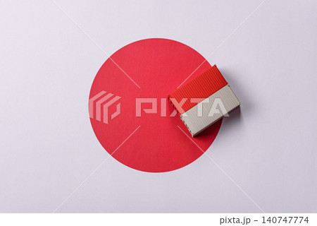 Cargo containers on the japanese flag as a conceptual backdrop. Cargo containers Cargo containers on the japanese flag as a conceptual backdrop. Cargo containers 140747774
